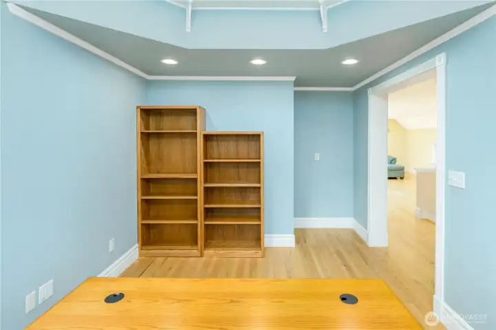 Dedicated office or study with built-in shelving potential, hardwood floors, recessed lighting, and an open layout that flows seamlessly to the adjacent bonus room. The perfect space for a home office, library, hobby room, or creative workspace. Dedicated office or study with built-in shelving potential, hardwood floors, recessed lighting, and an open layout that flows seamlessly to the adjacent bonus room. The perfect space for a home office, library, hobby room, or creative workspace.
