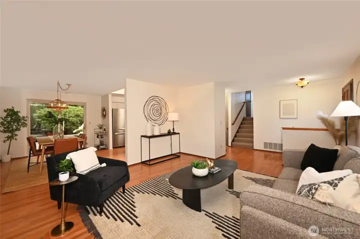 Living room to dining room and stair access to upper level