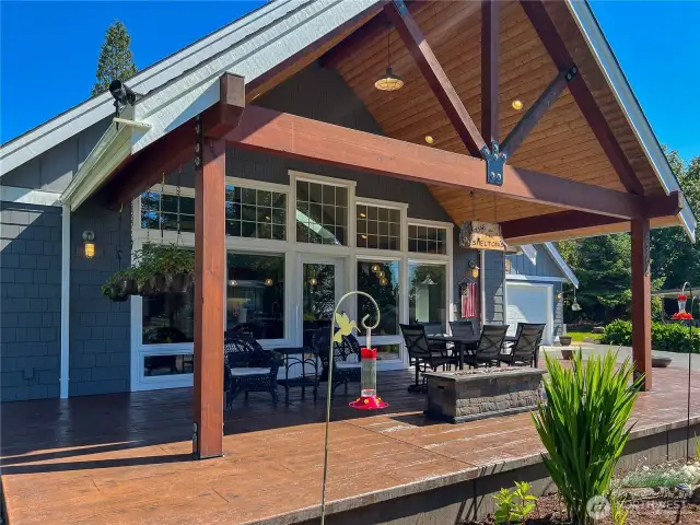 What a wonderful place to relax and enjoy the views and the outdoors. The wrap around concrete brown tinted patio is low maintenance. The covered vaulted knotty pine lined patio is perfect for the NW weather complete with natural gas heater.