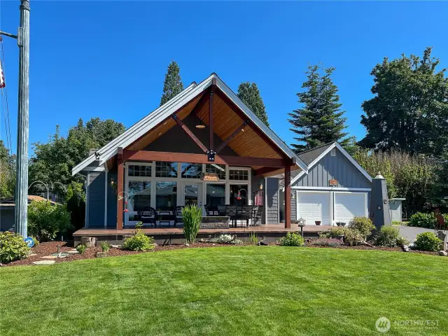 Additional view of the home and garage from the street.