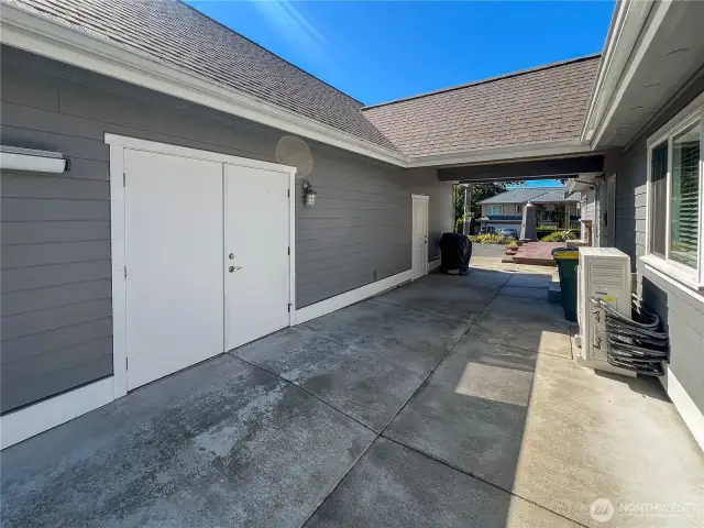 Double door access to shop area behind the 2 car garage.
