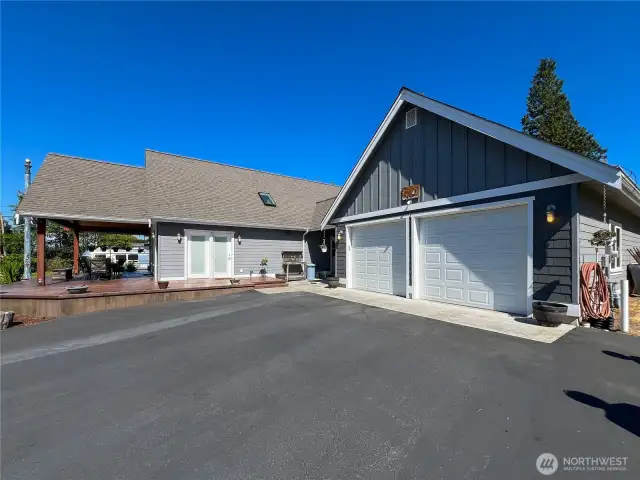 The driveway is blacktopped for low maintenance.