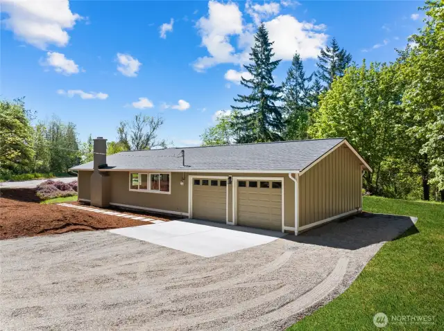 2-car garage with wide driveway (edited with grass)