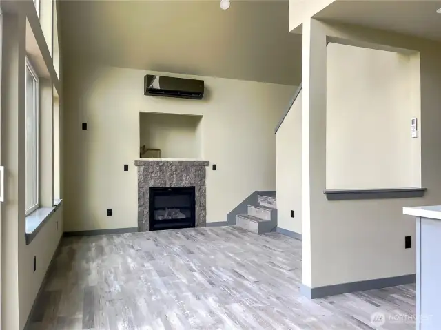 Stairwell leading to primary off living room