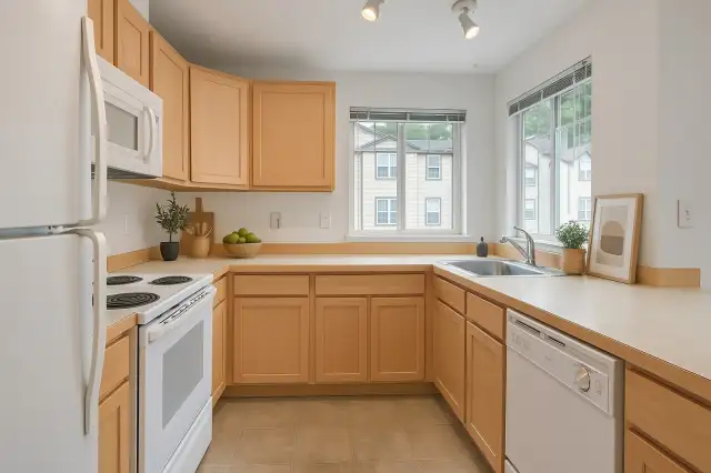 Kitchen with tons of natural lighting and an abundance of storage. Virtually Staged.