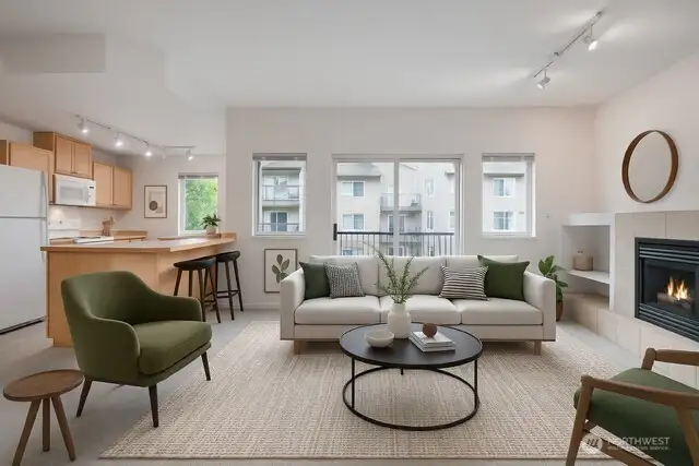 Living room opens up to deck and kitchen. Virtually Staged.