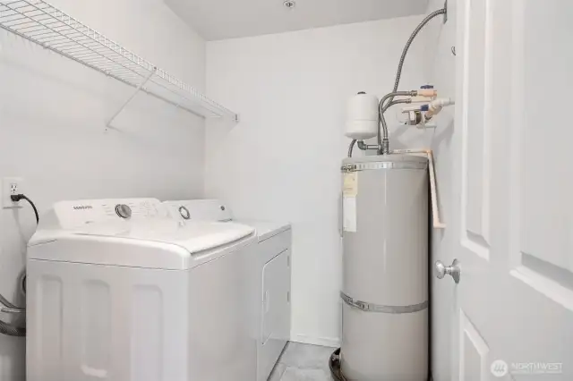 Laundry room with full size washer and dryer.