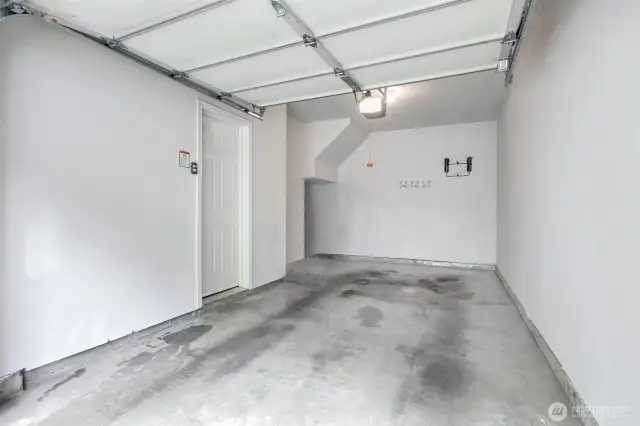 Attached one car garage with space for storage.