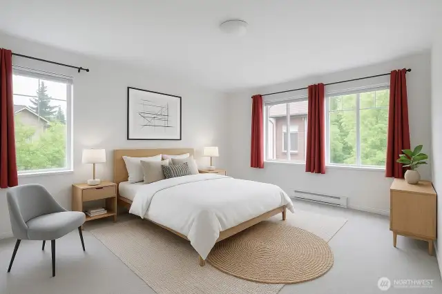 Primary bedroom with tons of natural lighting and walk in closet. Virtually Staged.