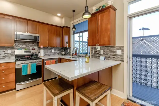 Beautiful new quartz countertops and tile backsplash!