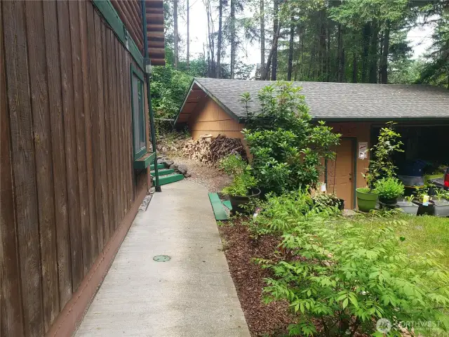 Concrete apron walkway to from main house to detached garage