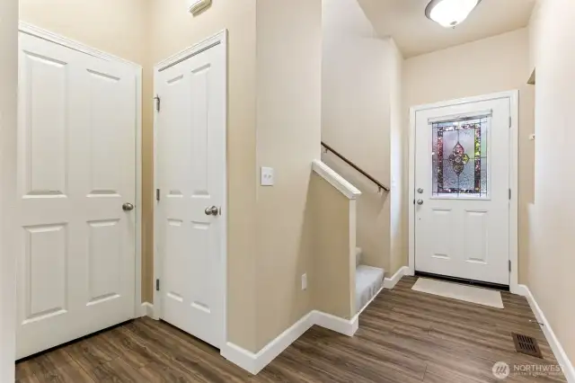 Lots of storage with coat closet and under stairs closet.