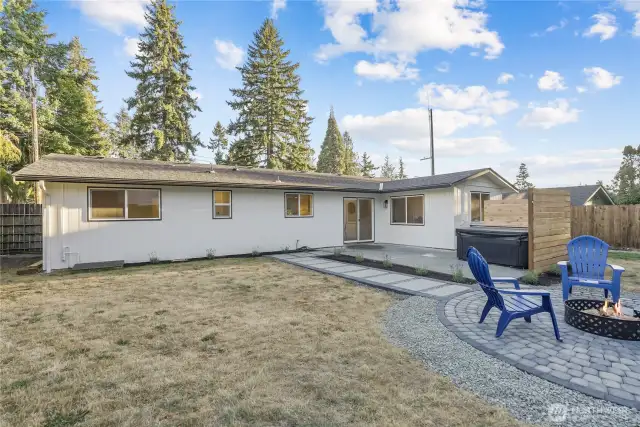 Fantastic entertainers yard with pavered fire pit