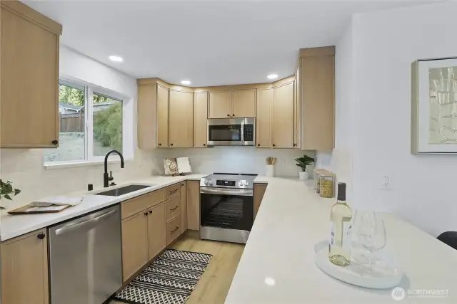 Stunning thin shaker cabs with New SS appliances and Quartz counters ooh la la!