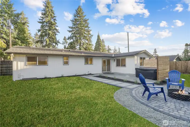 Fantastic entertainers yard with pavered fire pit