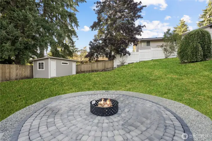 large pavered firepit area for laughs and memories