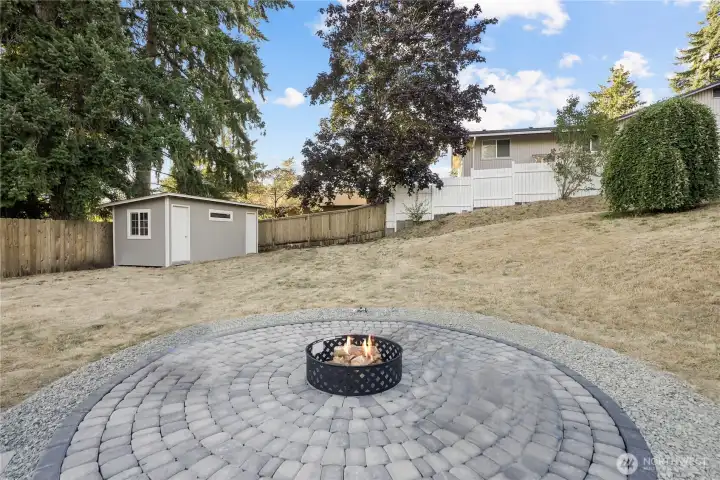 large pavered firepit area for laughs and memories