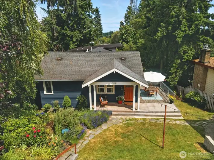 Front exterior with rocking swing front deck and entertaining side patio