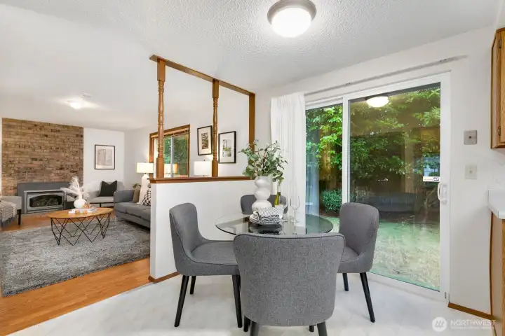 There's a sliding glass door next to the dining area that goes out to the backyard.