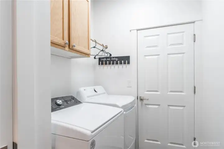 Separate Laundry room with door. Exterior door to garage