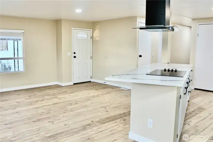 the living room looking onto the door that leads to carport and shed
