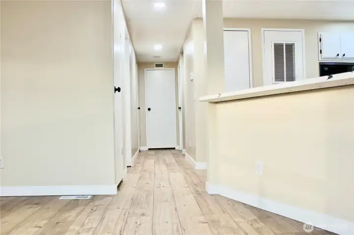 the corridor to the bathroom. rooms and laundry as well as the pantry and storage