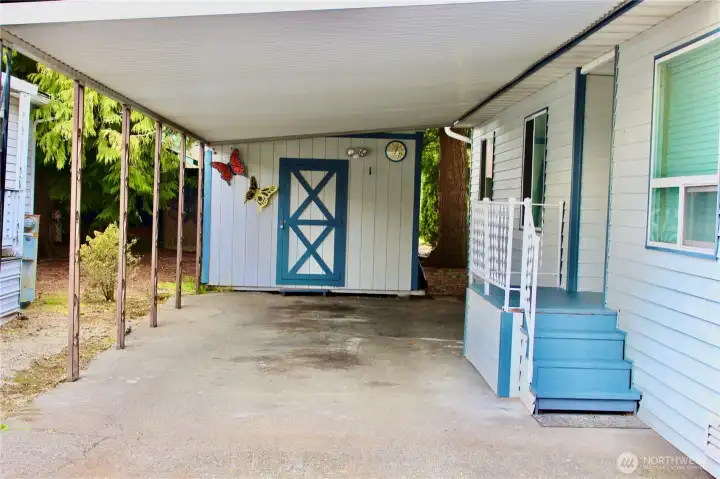 The carport and shed that's locked with its own key to unlock