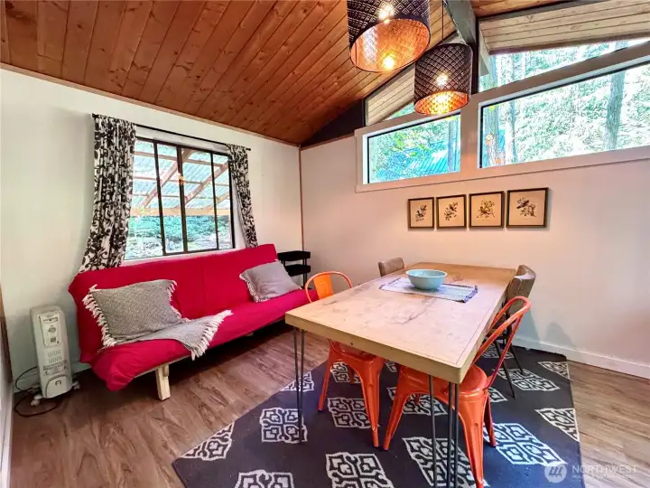 Open layout with enough space for full dining table and living room furniture