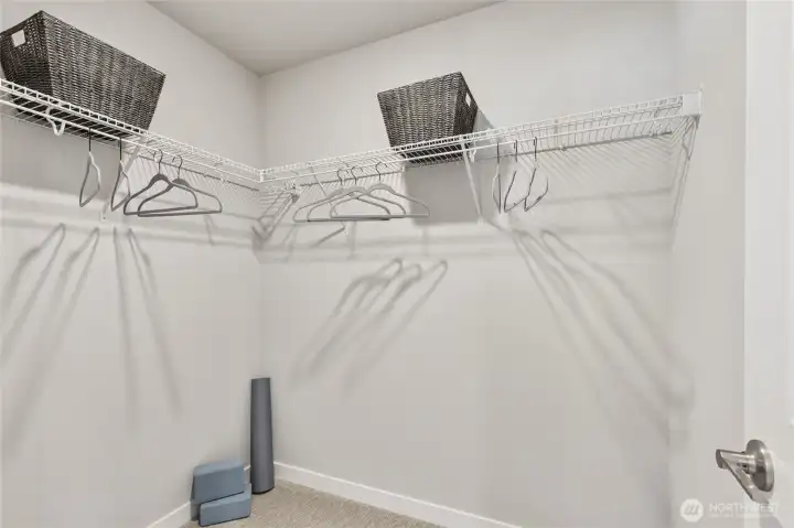 Primary bedroom spacious walk-in closet offering ample storage and organization space.