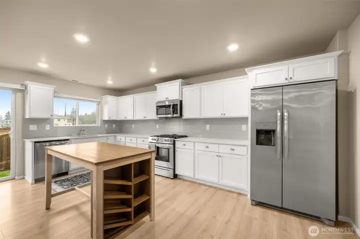 Kitchen with cool island. Enough seating for 4.