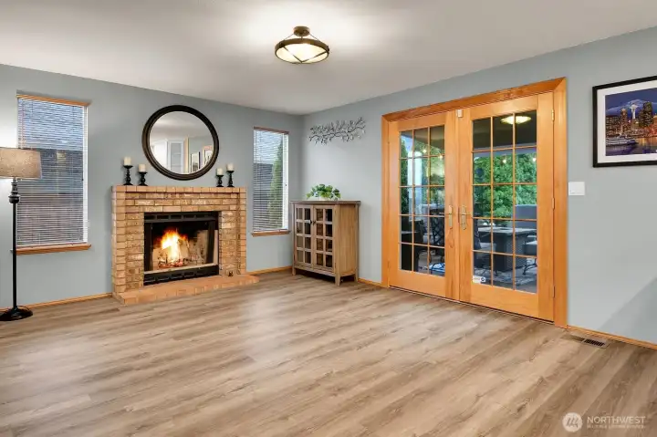 French doors open to a covered and uncovered deck space, ready for year-round enjoyment.