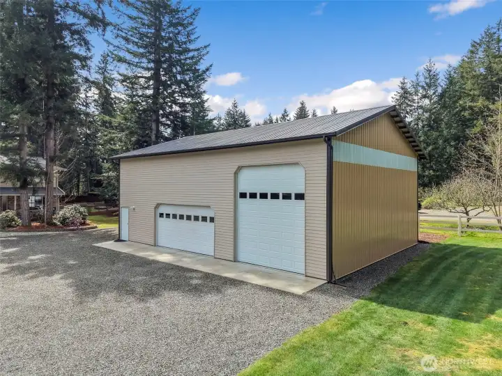 Bring all your hobbies and toys!  Holds 4 cars and 1 Rv!  Massive mezzanine w/wide walk up stairs for all your storage needs.
