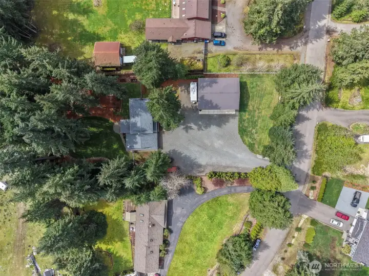 Look at all the parking and mature grounds!  6 covered parking, 1 rv covered and room for multiple recreational toys and cars!