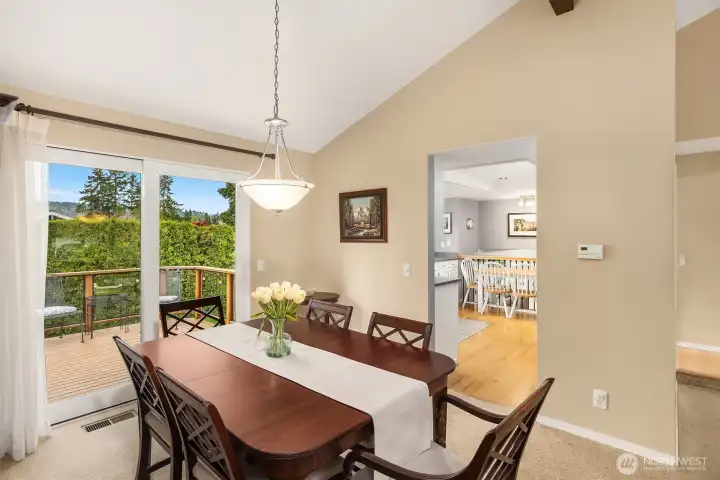The formal dining room with kitchen and direct access to the upper deck