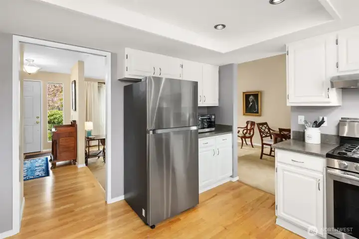 Kitchen, entry and formal dining and living rooms