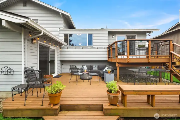Lower deck and upper deck overlooking the serene backyard