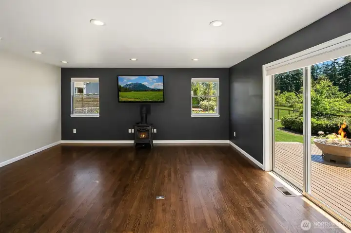 Great room with slider to decking with hot tub in main house Great room with slider to decking with hot tub in main house