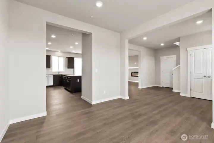 Easy access from dining room into kitchen;  Bakerview Huntington has light gray painted cabinetry.  Other fiinishes will vary.