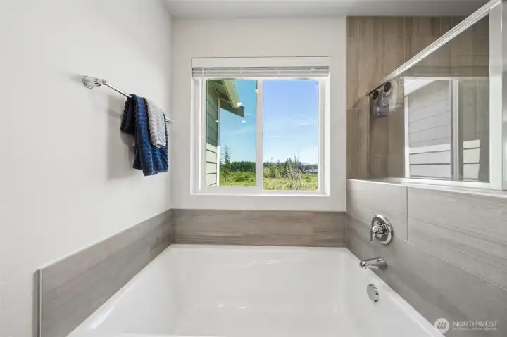 Large soaking tub in Primary bathroom