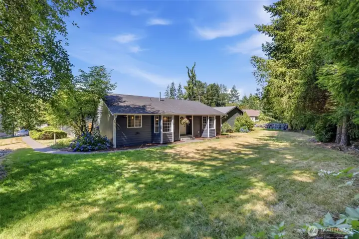 Nestled into a park-like yard surrounded by tall trees, you'll feel at peace here.