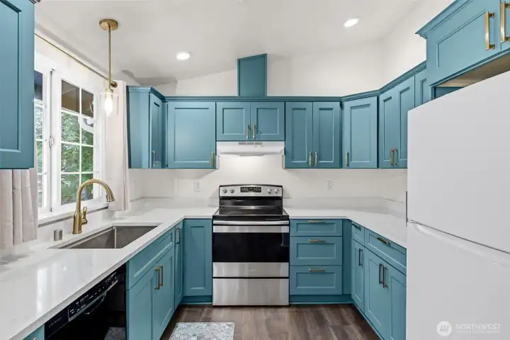 Wow, the custom kitchen! All appliances stay.
