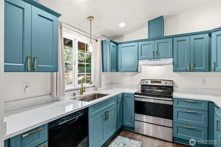 All new cabinets, quartz counters and under-mount sink.