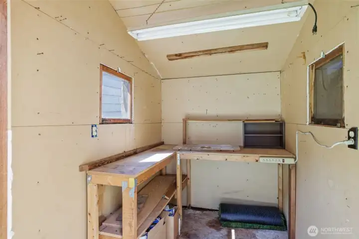 Inside of back yard storage unit, with power.