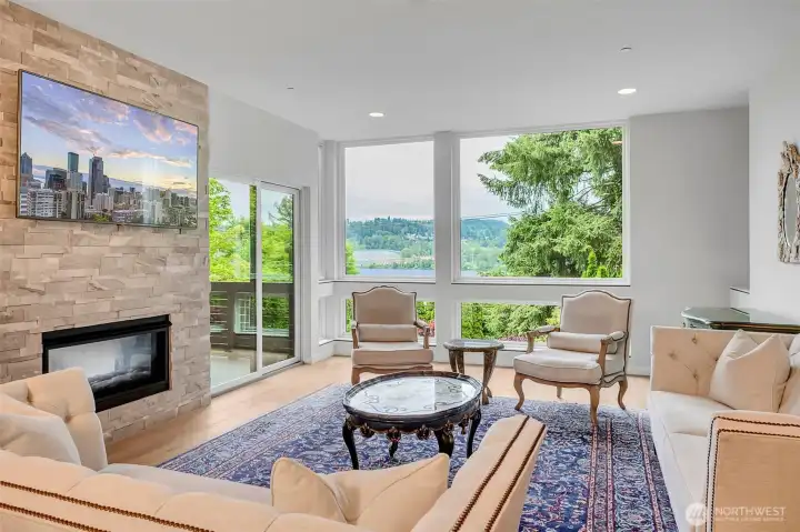 Open great room design and what a view! Lake Washington and the excitement of the Seahawks training facility just across the lake. Fireplace is two-sided and also illuminates the covered deck. Open great room design and what a view! Lake Washington and the excitement of the Seahawks training facility just across the lake. Fireplace is two-sided and also illuminates the covered deck.