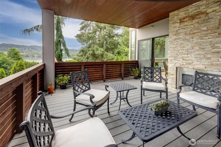 Covered deck with stunning views and cozy fireplace is perfect for year round use. Covered deck with stunning views and cozy fireplace is perfect for year round use.