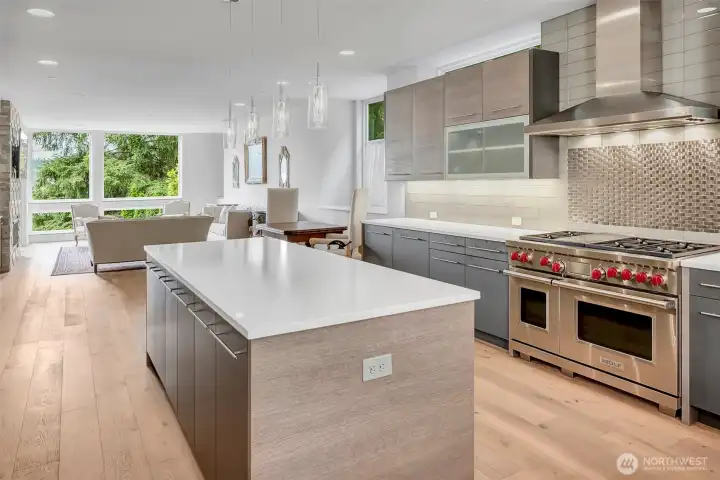 Open great room design is built with entertaining in mind. Slab quartz countertops are clean lined, gorgeous and low maintenance. Wolf six burner plus griddle cook top and double oven is exactly what every home chef wants. Open great room design is built with entertaining in mind. Slab quartz countertops are clean lined, gorgeous and low maintenance. Wolf six burner plus griddle cook top and double oven is exactly what every home chef wants.
