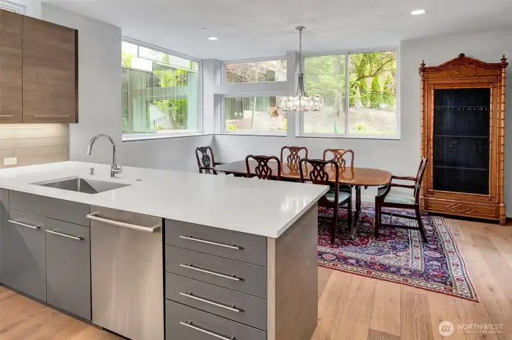 A secondary island is the perfect spot for morning coffee. Open eating area is large and bright surrounded by windows and opens to the back yard deck. A secondary island is the perfect spot for morning coffee. Open eating area is large and bright surrounded by windows and opens to the back yard deck.
