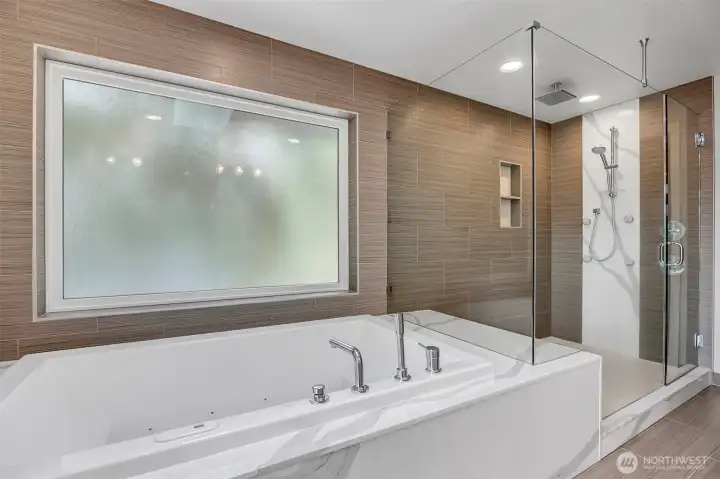 Completely tiled walls and custom niches. Double headed shower including rain shower make this a truly luxe experience. Completely tiled walls and custom niches. Double headed shower including rain shower make this a truly luxe experience.