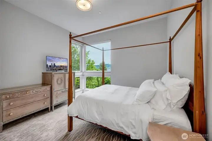 All of the upper level bedrooms are generously sized with walk in closets. High ceilings and a view of the lake with adjacent private bate. All of the upper level bedrooms are generously sized with walk in closets. High ceilings and a view of the lake with adjacent private bate.