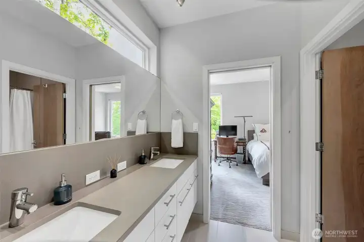 Two of the upper level bedrooms share this "Jack and Jill" style bath. Transom window above the mirror allows nice light to come into this space while maintaining privacy. Two of the upper level bedrooms share this "Jack and Jill" style bath. Transom window above the mirror allows nice light to come into this space while maintaining privacy.